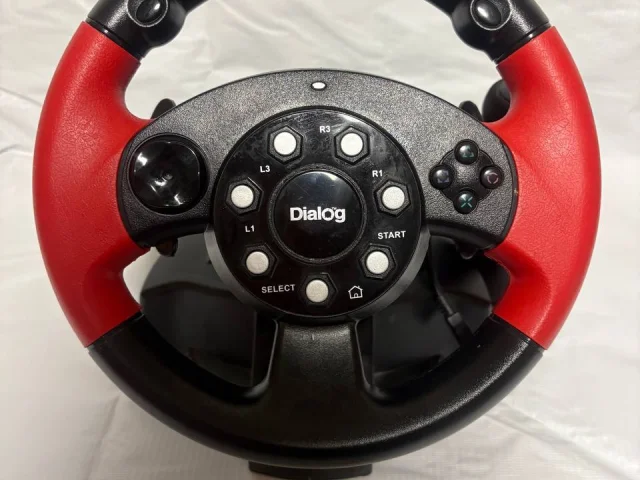 Фото: Продам игровой руль Dialog GW-225VR. В хорошем состоянии всё работает, есть виброотклик, кпп вперёд назад, две педали та